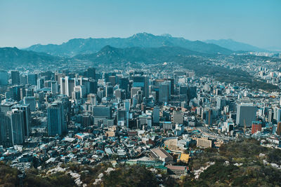 High angle view of modern buildings in city against sky
