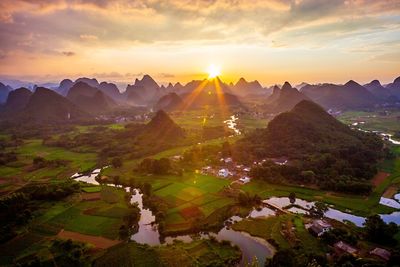 Scenic view of landscape against sky during sunset