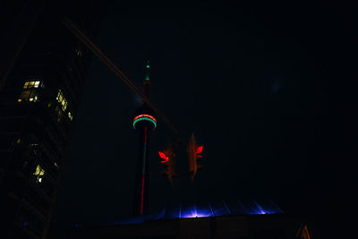 Low angle view of illuminated flags at night