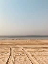 Scenic view of beach against clear sky