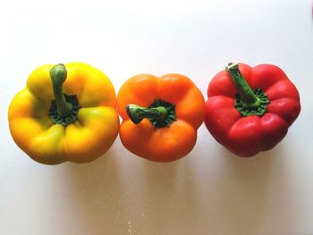 Close-up of bell peppers against white background