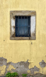 Low angle view of window on wall of building