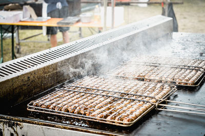 Close-up of sausages on barbecue grill