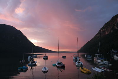 Boats moored at harbor