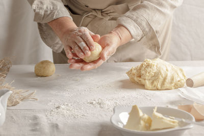 Midsection of man preparing food