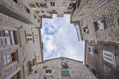 Low angles shot of old stone buildings in the old town of kotor, montenegro