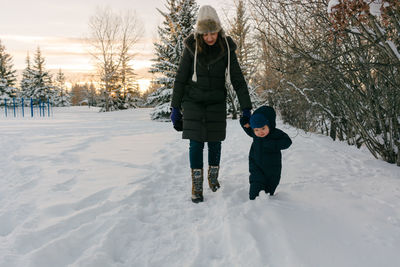 Full length of two people in snow