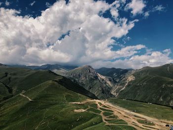 Scenic view of landscape and mountains against sky