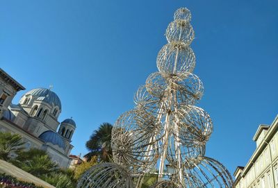 Low angle view of tree against clear blue sky