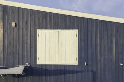 Wooden fence against sky