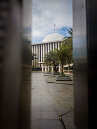 View of street amidst buildings against sky