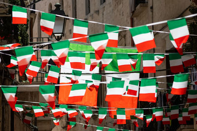 Multi colored flags hanging umbrellas