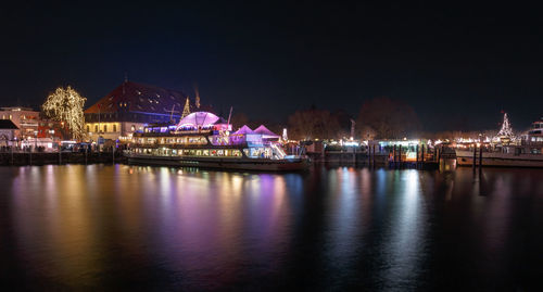 Illuminated buildings in city at night