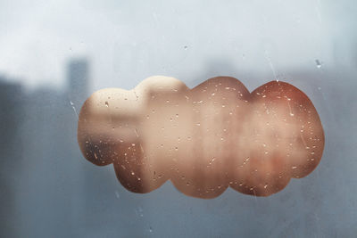 Close-up of raindrops on glass window