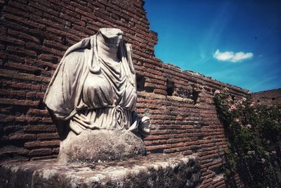 Low angle view of statue against sky