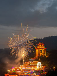 Firework display at night