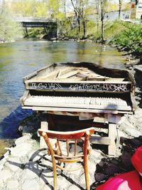 High angle view of bench in lake