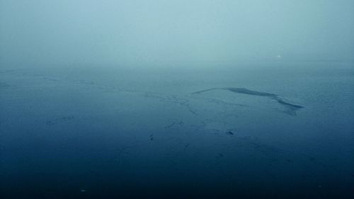 Scenic view of sea against blue sky