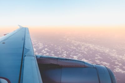 Aerial view of airplane wing against clear sky