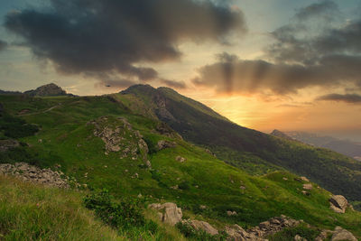 Scenic view of landscape against sky during sunset