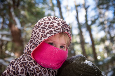 Portrait of boy wearing hat against trees