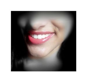 Close-up portrait of a smiling young woman