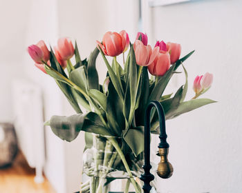 Close-up of red roses in vase at home