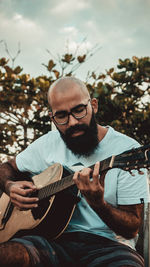 Young man playing guitar