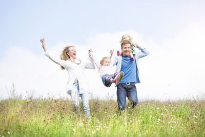 Carefree family in meadow