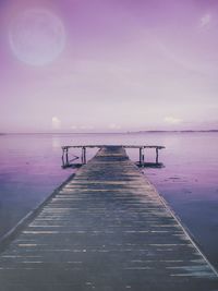 Pier over sea against sky