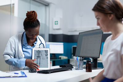 Side view of doctor working at office