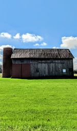 House on field against sky