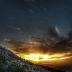 Scenic view of mountains against sky during sunset