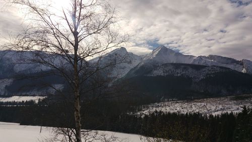 Scenic view of snowcapped mountains against sky