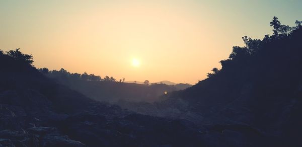 Scenic view of mountains against sky during sunset