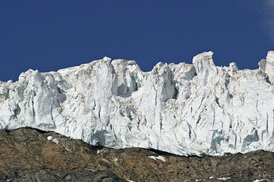 View of the swiss alps against clear blue sky