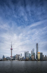Buildings in city against sky