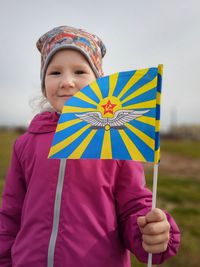 7 year's girl with a russian airforce flag