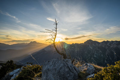 Scenic view of mountains against sky during sunset