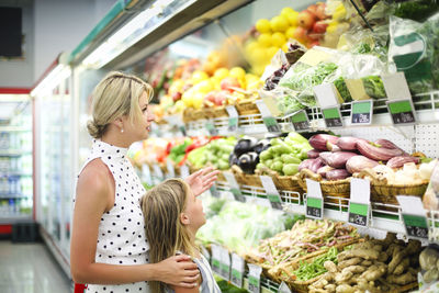 Mother and daughter at supermarket