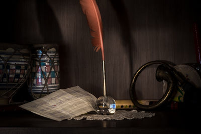 Close-up of open book on table at home