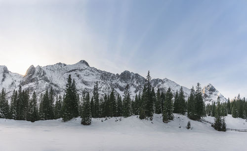 Scenic view of snow covered mountains against sky