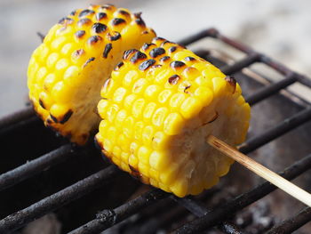 Close-up of yellow meat on barbecue grill