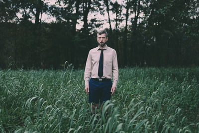 Young man standing on field