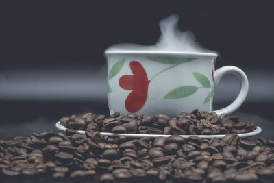 Close-up of coffee beans on table