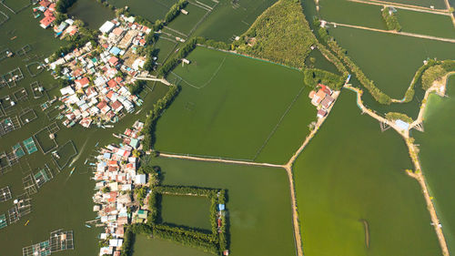 Aerial view of fishing village among fish farm ponds. philippines.