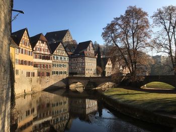 Reflection of old buildings in river