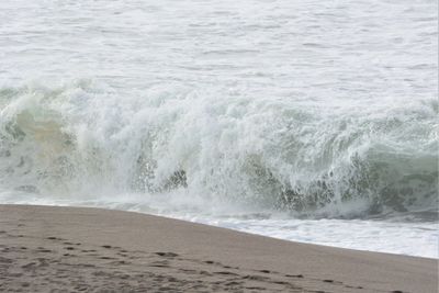 Waves splashing on shore at beach