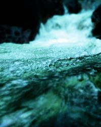 Close-up of water flowing through rocks