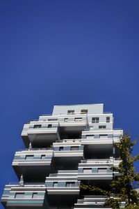 Low angle view of building against clear blue sky